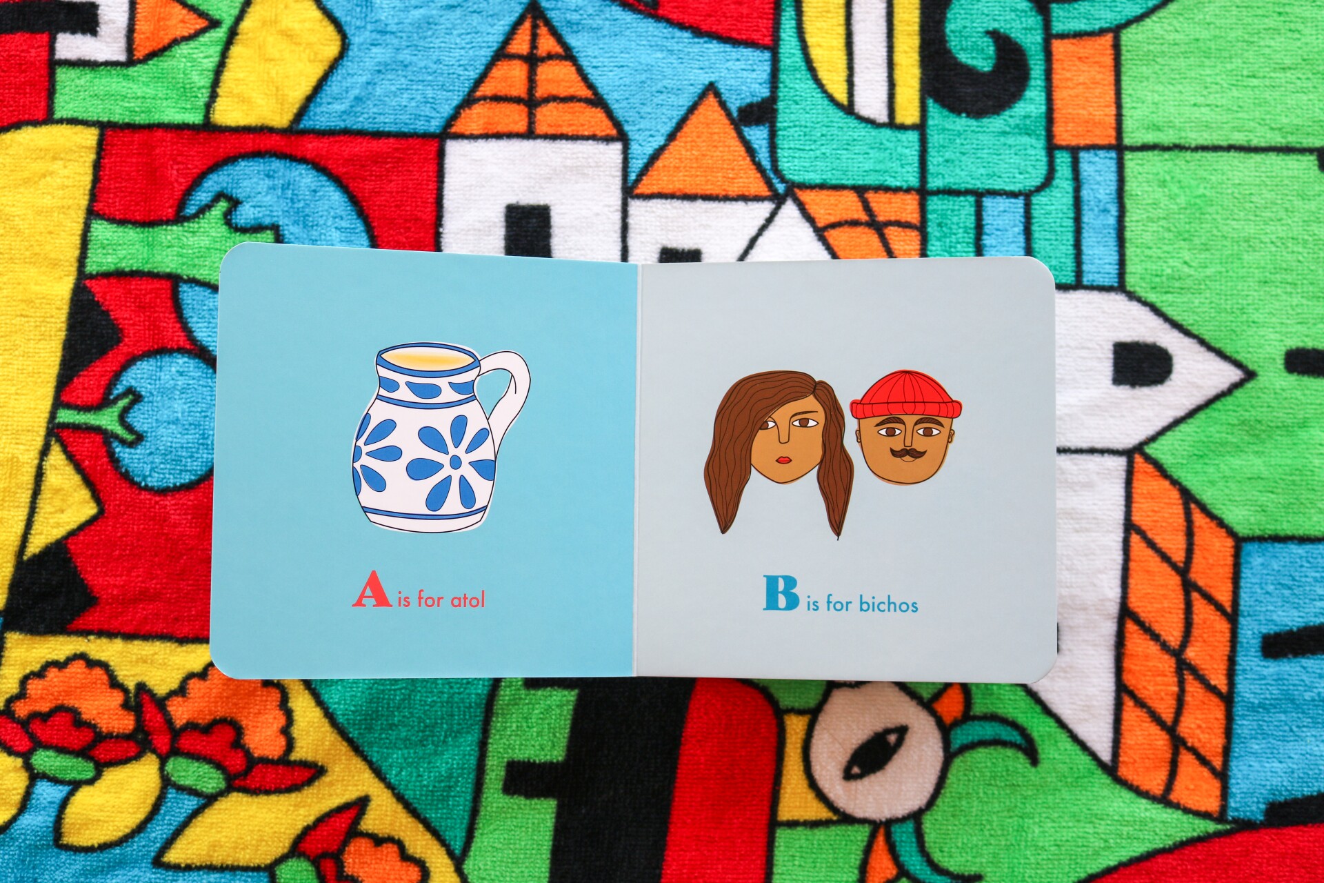 pages of an open book illustrated with a pitcher on one page and two young people in the other.