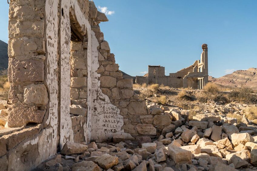 The ruins of Rhyolite's John S. Cook & Co. Bank (at right back) | Kim Stringfellow, August 2018.