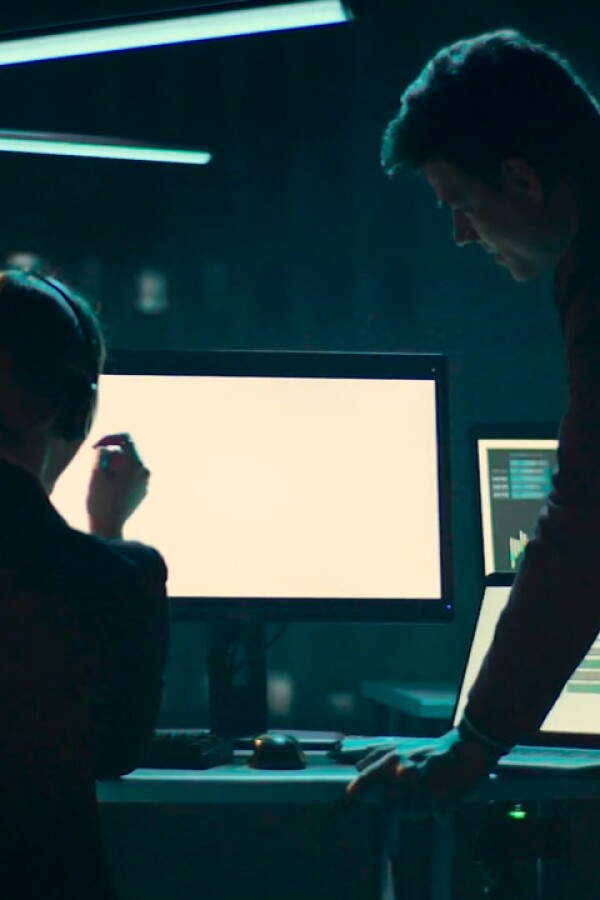 Image graphic of two people looking at a monitor.