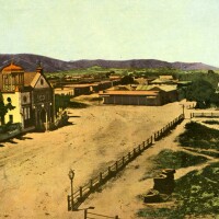 Hand-tinted 1869 photograph of the Los Angeles Plaza and Plaza Church. Courtesy of the Los Angeles Public Library Photography Collection.