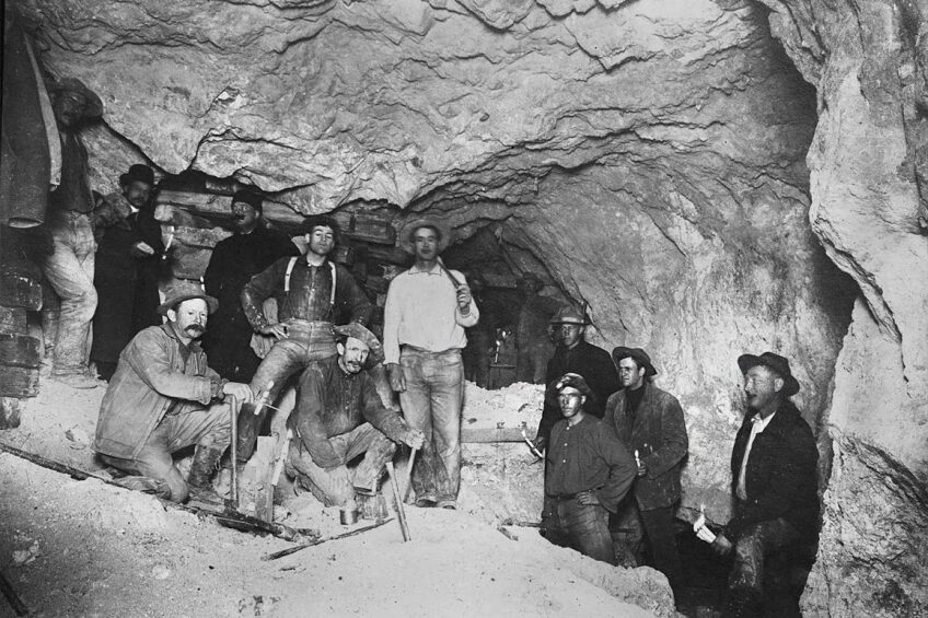 A group of miner's deep within Goldfield's Mohawk Mine (pictured here near an $80,000 gold ledge). | Charles C. Pierce. Courtesy of USC Libraries and California Historical Society.